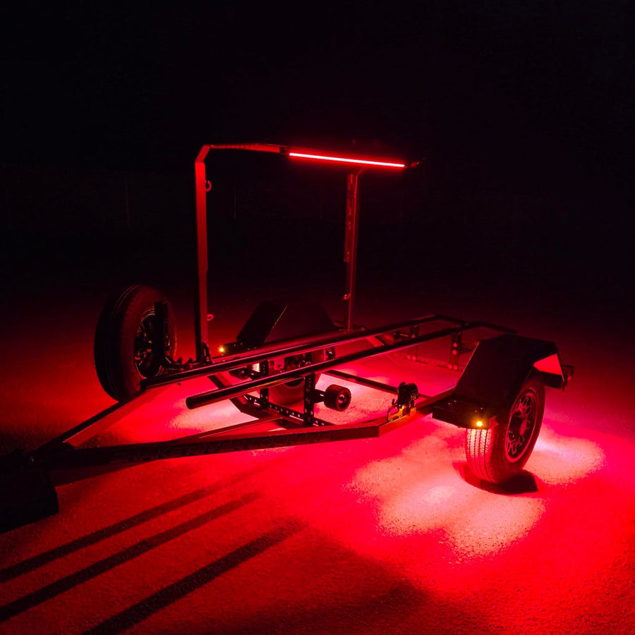 Off-road trailer at night with a Kingpin F-Series light in red mode