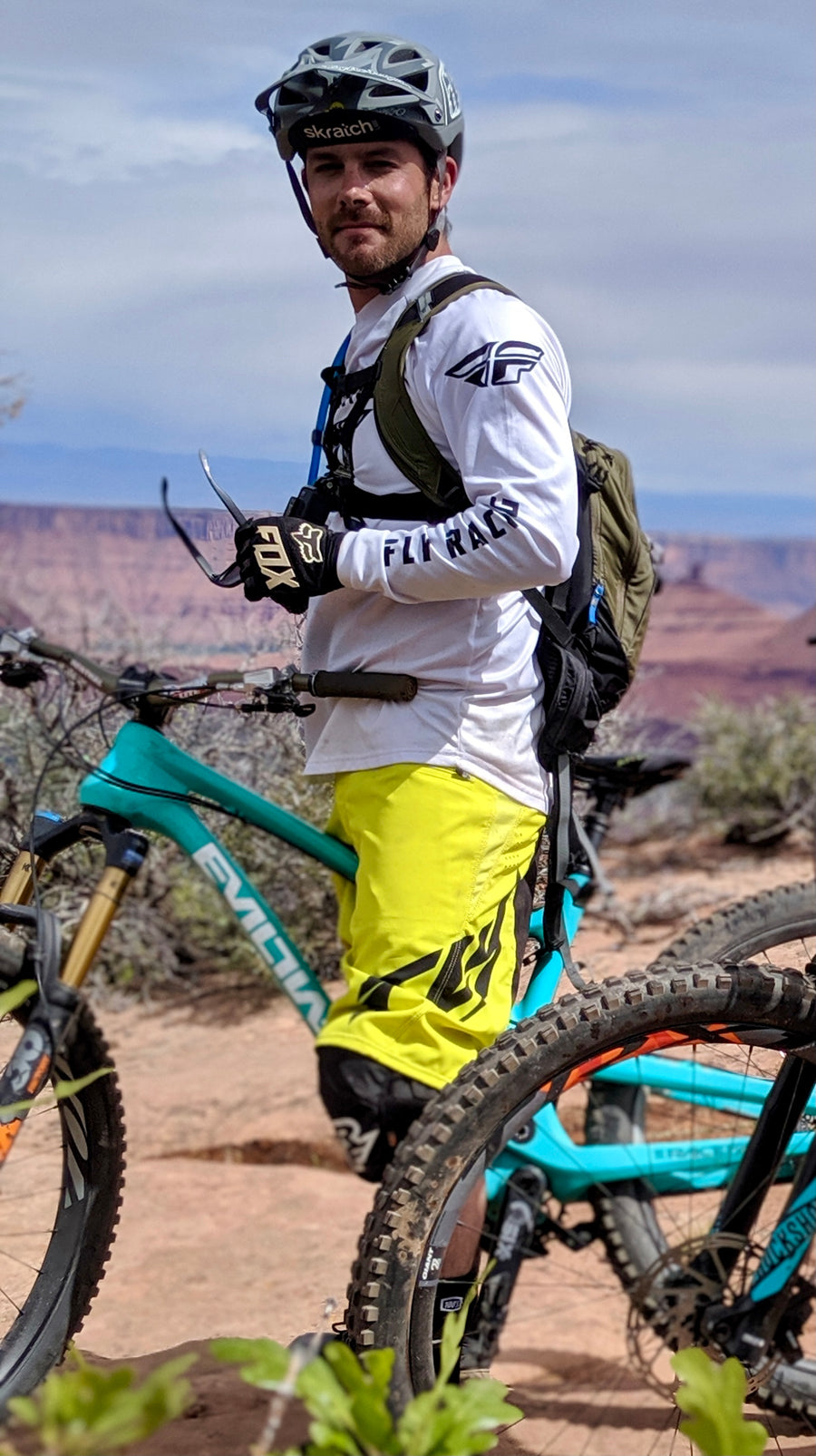 Chance, Kingpin's founder, with his mountain bike in the desert