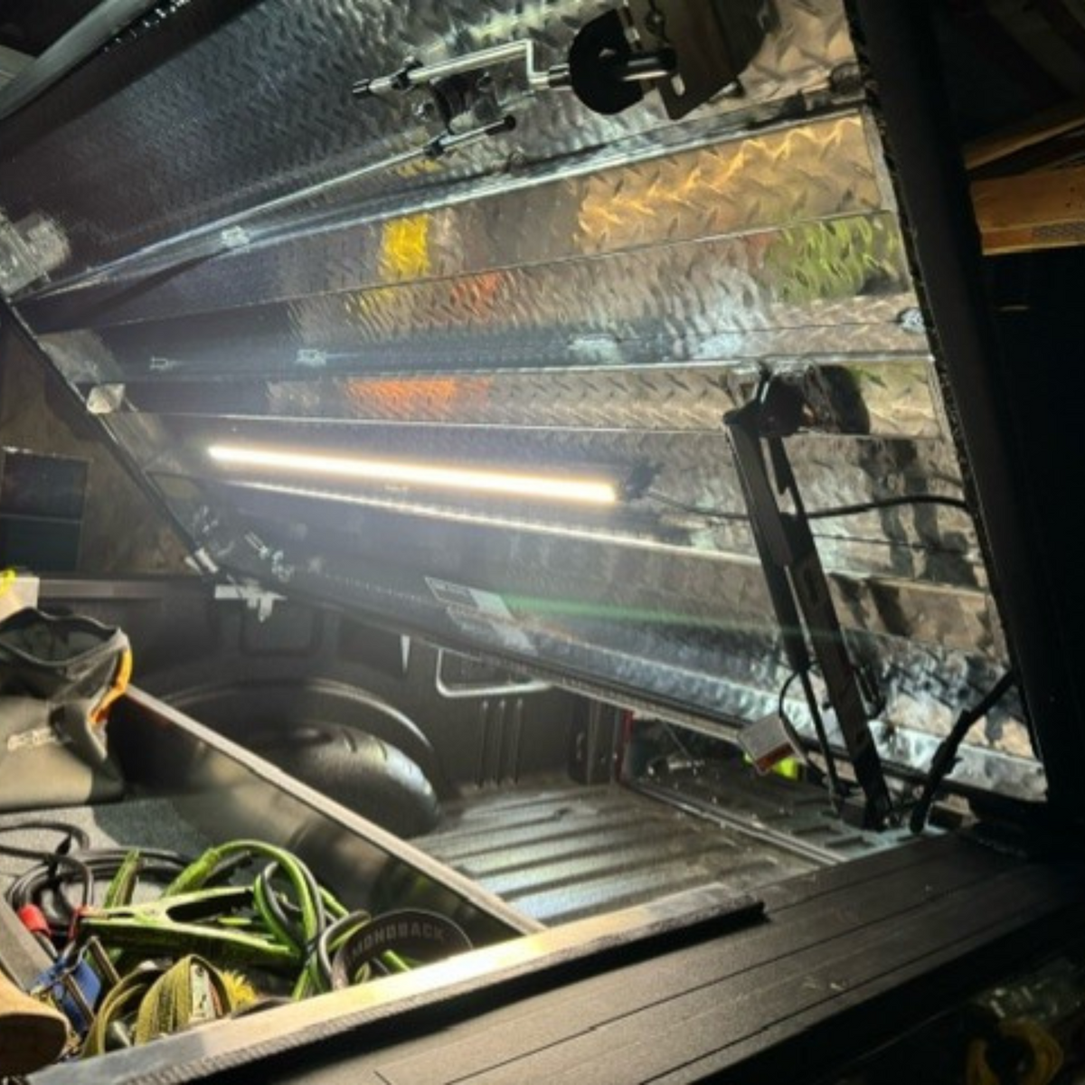 Aluminum work truck compartment lit by a Kingpin light