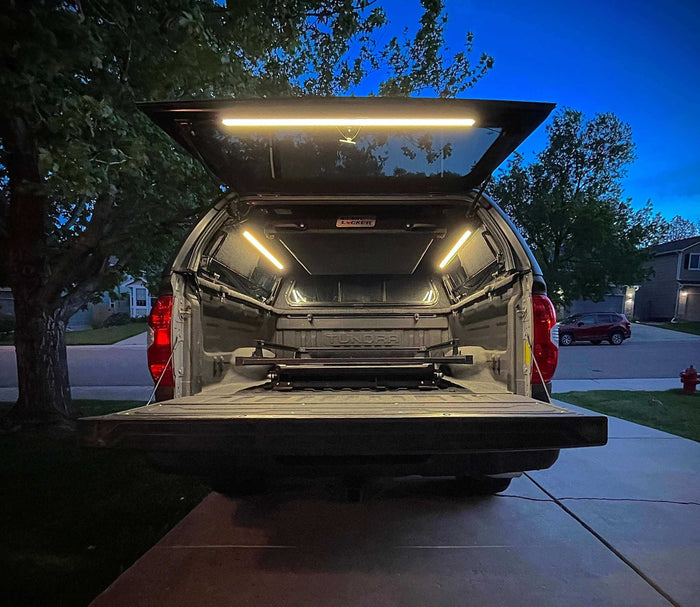 Truck cap with the tailgate down and the bed lit by Kingpin lights