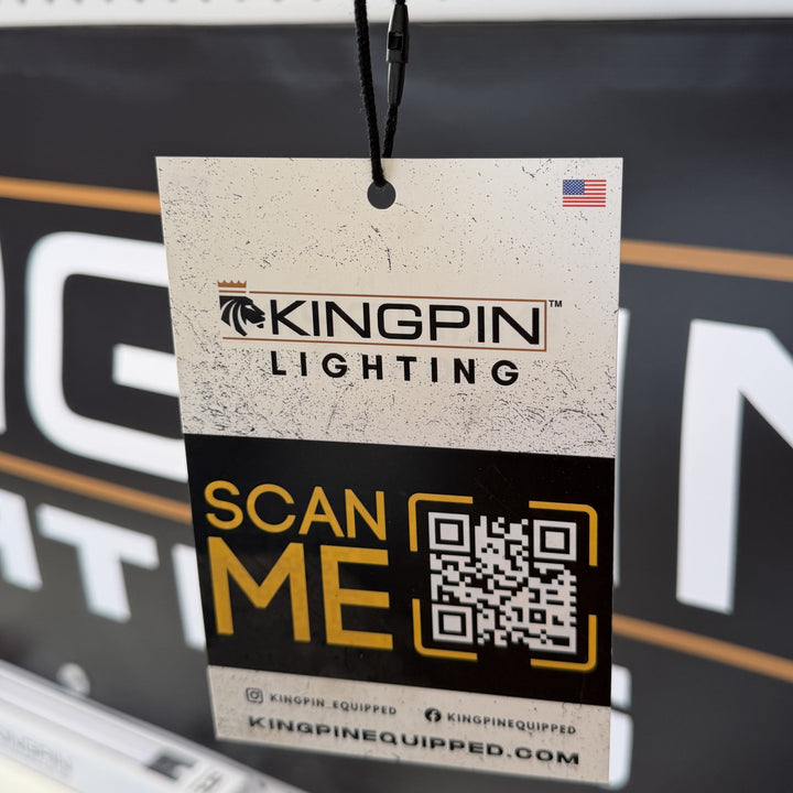 Kingpin Lighting QR code hang tag in front of a Kingpin banner