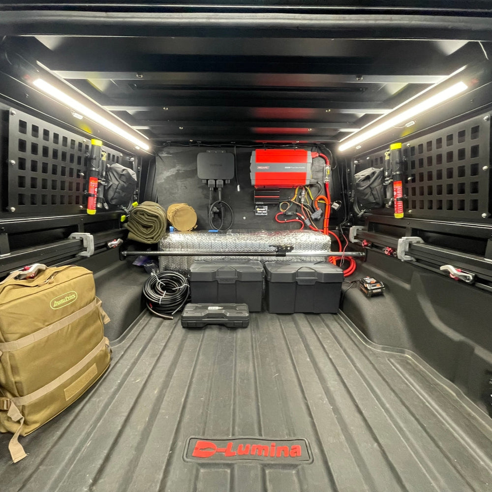 Trunk of a vehicle with various equipment and tools with lightbars setup.